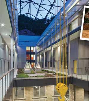 INDUSTRIAL CHIC: An old crane hangs high above the courtyard at the Assembly Building, part of Clipper Mill, as a tribute to the site's historical past.