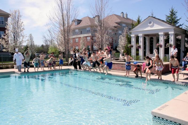 All In: Village Green Cos.' residents at Regents Park of Troy in Troy, Mich., jump into their community pool as part of Splash Day, a summer kick-off party and fundraiser.