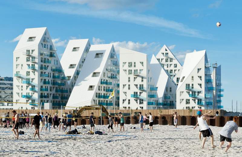 The Julien De Smedt Architects design team hopes to build a warm, vibrant community around the newly constructed Iceberg apartments in Aarhaus, Demark.