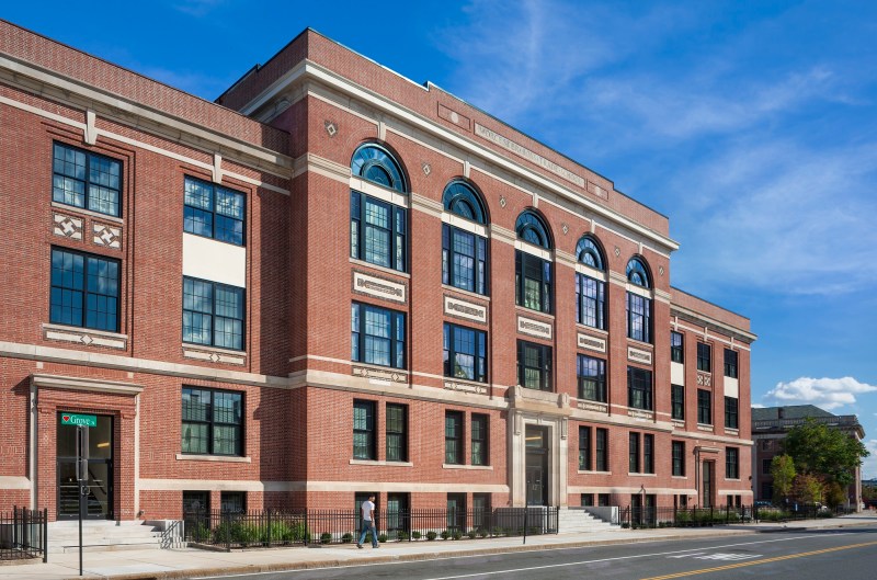 The front elevation at Voke Lofts evokes the building's scholastic past with stone and red brick elements that echo the original.