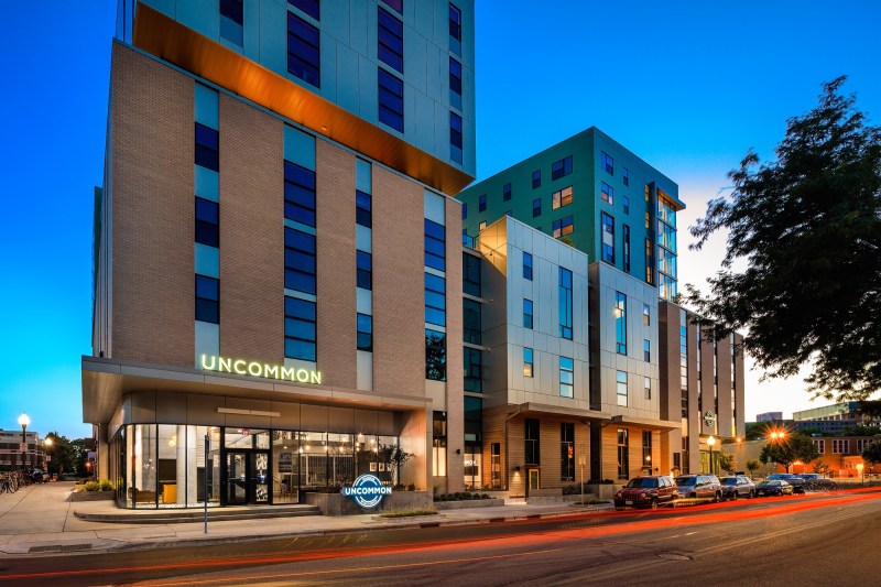student housing, young professionals, college town, mixed materials, multi-level facade.