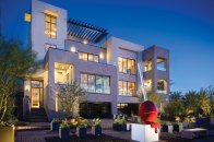 Though the Vu's exterior blends with the desert rockscaping, pops of color come from the desert flowers planted as well as accents of color throughout on doors, window frames, awnings, and even pots and artwork spaced strategically.