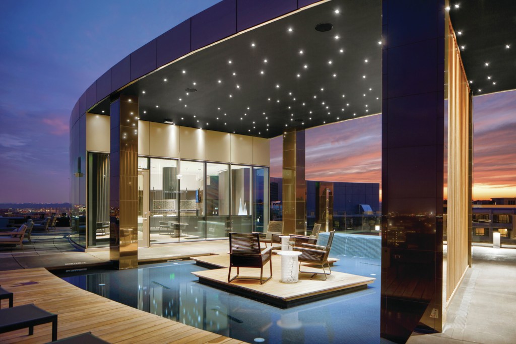 Bozzuto’s luxury Hepburn building in Washington, D.C., boasts a rooftop with lounge space, grills, and a reflecting pool.