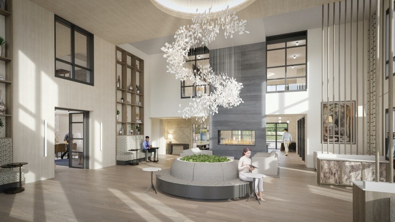 The lounge-like lobby Morgante Wilson Architects designed for Lumen Fox Valley features double-height ceilings and a variety of seating areas, including a circular banquette.