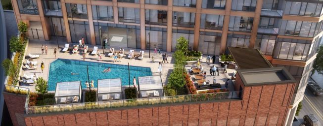 The outdoor pool deck at the Cassidy on Canal high-rise in Chicago features shaded cabanas and a poolside terrace with grills, a cooktop, a refrigerator, and fire pits.