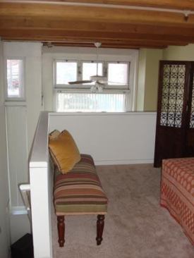 The studio in historic St. Paul is renting for $815/month and features include exposed heavy timber posts and beams and expansive windows.