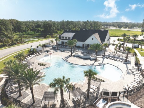 The community pool in Sienna Cove by AMH in Wesley Chapel, Florida, is one of several amenities promoting gathering in outdoor spaces.