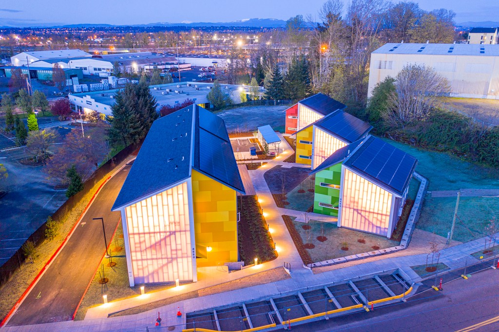 Argyle Gardens offers 72 units for low-income and formerly homeless residents. Each building at Argyle Gardens is composed of modular unit components assembled in rows off-site and crane-lifted onto foundations. The community’s exterior finishes disguise the modular structure.