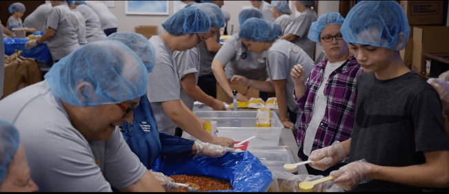 Glick team members and families give back to their community though Glick Cares. Credit: Gene B. Glick Company