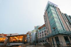 University of Chicago’s eight-story South Campus Residence Hall was designed with transparency and openness in mind. It is divided into eight four-story houses, each with internal staircases and spacious lounges. The building also features two courtyards, two large common areas, a reading room, music room, and a street-level caf&eacute; and convenience store. A short walk from the main campus, South Campus Residence Hall engrosses students with its carefully planned community feel, while they absorb natural light through the many windows that envelop the airy building. Many of the building’s residents feel South Campus Residence Hall is the most social dormitory on campus, due partly to the building’s spaciousness and transparent exterior.