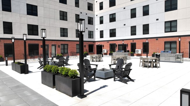 The Highland's courtyard deck includes chaises, gas grills, fire pits, and a dog park.