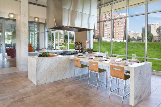 The development's communal kitchen and gathering table, along with other shared spaces at The Pearl, foster camaraderie.