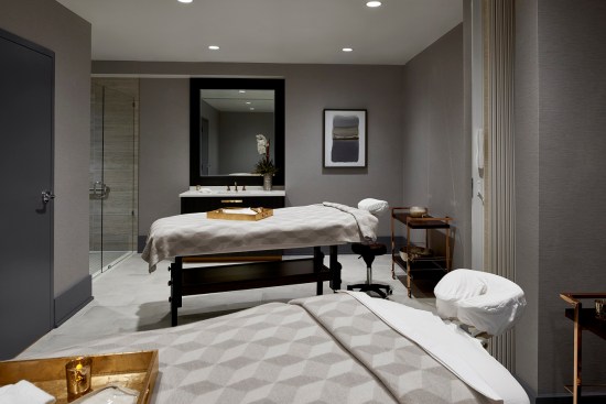Other amenities include a fitness center with cycling room, a steam room and sauna, and an on-site spa with massage tables.